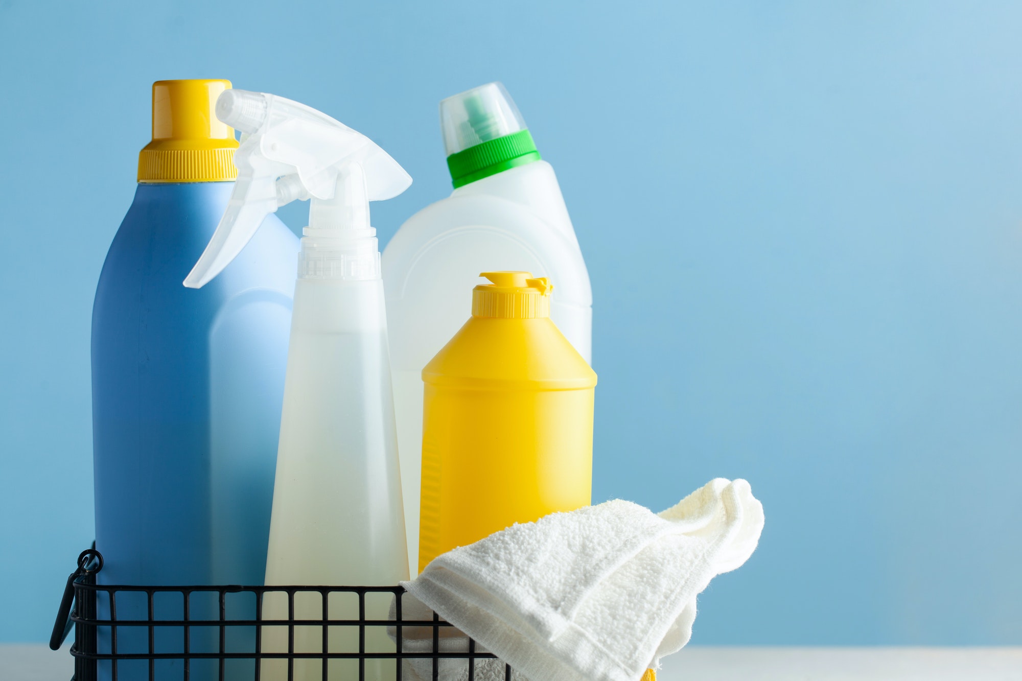 Cleaning products for cleaning, disinfection of the house, premises on a blue background.